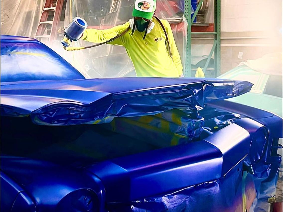 cam doing custom paint on a monte carlo restoration